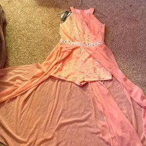 This is a romper dress nice comfortable never worn size 11-12 kids a china brand